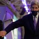 John Kerry, United States Special Presidential Envoy for Climate, right, touches the arm of Alok Sharma President of the COP26 summit during a stocktaking plenary session at the COP26 U.N. Climate Summit in Glasgow, Scotland on Saturday.